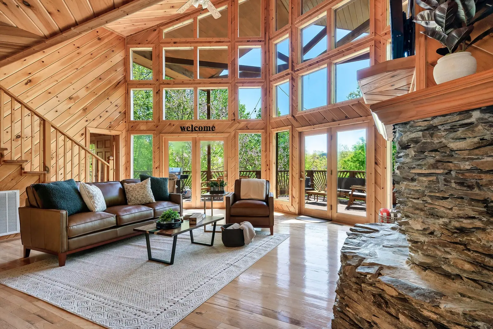 Open timber-frame living room with large windows